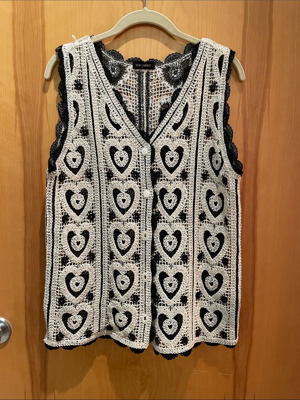 Crocheted vest with pretty flower buttons